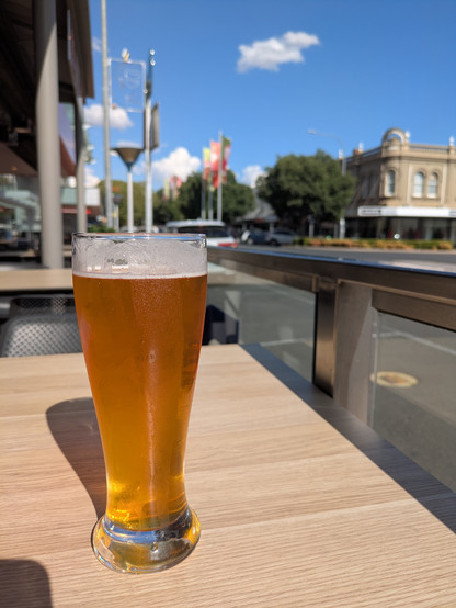 Glad of beer glistening in the sun.